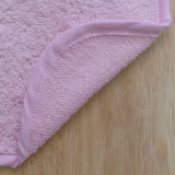 Babador felpudo rosa liso 20x25