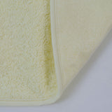 Babete atoalhado de plástico com borracha amarela
