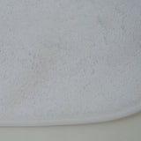 Babete atoalhado de plástico com borracha branca
